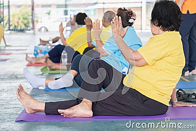 Elderly in a yoga exercise posture Editorial Stock Photo