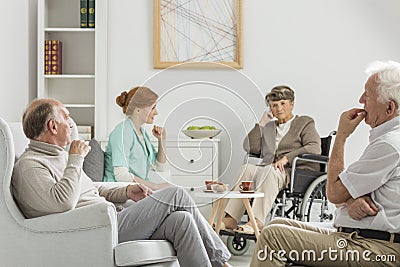 Elders and nurse meeting Stock Photo