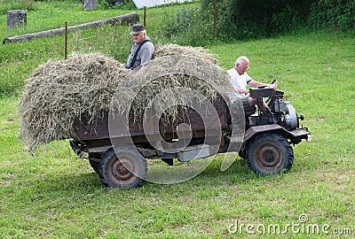 Eldery grandfather and son at work in the agricultural industry, Bohemia, Czech Republic Editorial Stock Photo