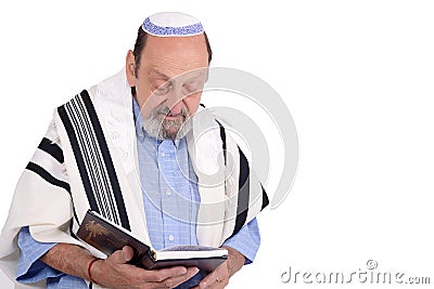 Eldery jewish man wrapped in talit praying Stock Photo
