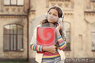 Elearning and modern methods. Distant education. Listening school book. Digital technologies for learning. Schoolgirl Stock Photo