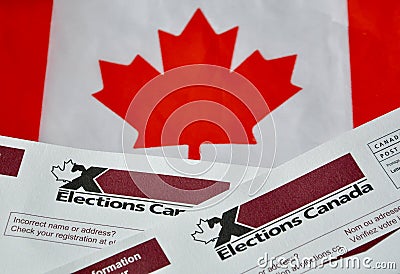 Election Canada voter information cards over small Canadian flag Editorial Stock Photo