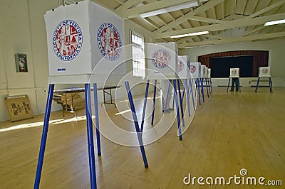 Election volunteers and voting booths in a polling place, CA Editorial Stock Photo