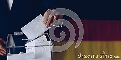 Elections in Germany. Man throwing his vote into the ballot box Stock Photo