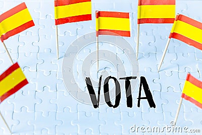 Elections in Spain, The concept of the Spanish flag and the inscription VOTA meaning vote in English on white puzzles Stock Photo