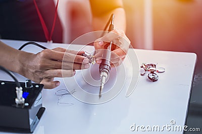 Electornic engineer using soldering iron Stock Photo