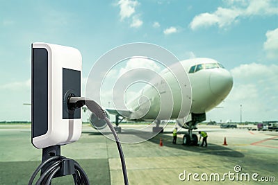Electric aircraft charger station with plug and power cable supply on cargo or airplane parking with blue sky background Stock Photo