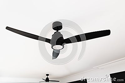 Electric black ceiling lamp with propeller, ceiling fan with ventilator Stock Photo