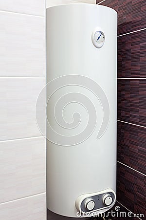 Electric Boiler wall water heater in bathroom. Stock Photo