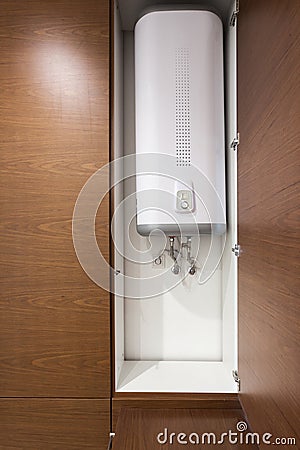 Electric Boiler wall water heater in bathroom. Stock Photo