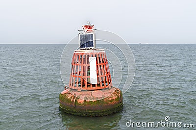 Electric bollard light or buoy on the open sea in the esuary of the Thames, England, UK Stock Photo