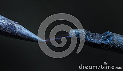 Electric cable close-up with glowing electricity lightning. Macro shot Stock Photo