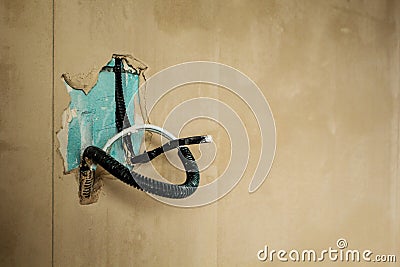 Electric cable in the wall. Construction and repair Stock Photo