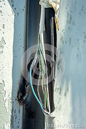Electric cable wire for air conditioner damaged by welding Stock Photo