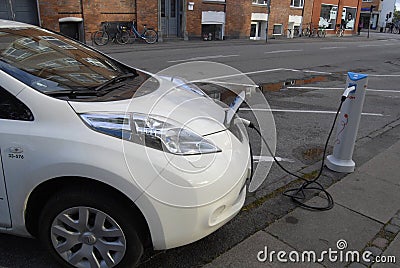 ELECTRIC CAR IS BEING CHARGE Editorial Stock Photo