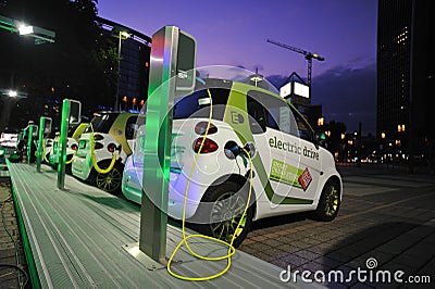 Electric cars powering at charging station Editorial Stock Photo