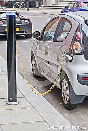 Electric Car Charging Stock Photo