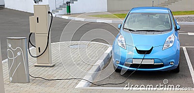 Electric Car Charging Stock Photo