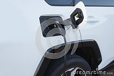 Electric car charging power station plug renewable energy Stock Photo