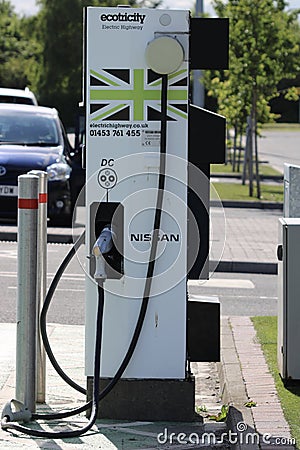 Electric Car Charging Station in a Car Park Editorial Stock Photo