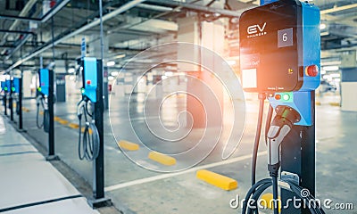 Electric car charging station for charge EV battery. Plug for vehicle with electric engine. EV charger. Clean energy. Charging Editorial Stock Photo