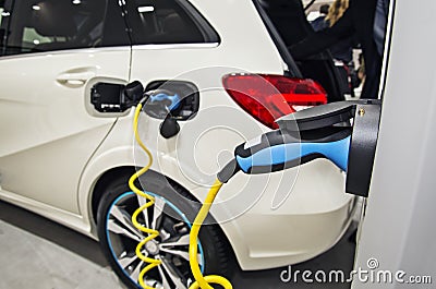 Electric car at the charging station Stock Photo