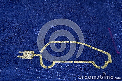 Electric car pictogram with electric plug instead of an exhaust. It is marking of a park place for a car with charging station. Stock Photo