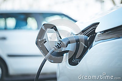 Electric car is refueling up its batteries, future innovation of mobility Stock Photo