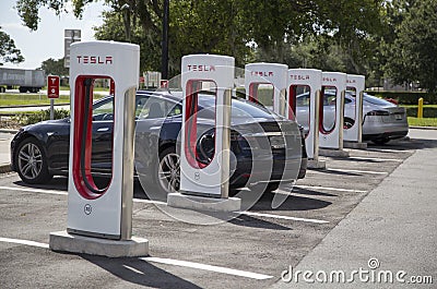 Electric cars at Tesla recharging stations Editorial Stock Photo