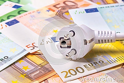 an electric close-up fork lies on the money banknotes. The concept of economy Stock Photo