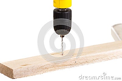 Electric drill drilling wood plank Stock Photo