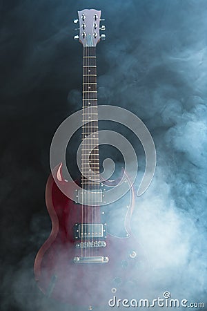 Electric guitar in dense smoke Stock Photo