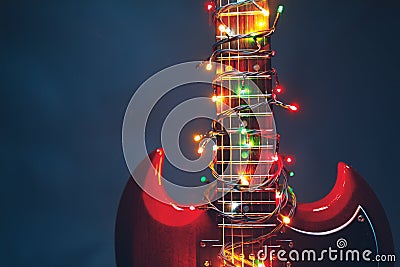 Electric guitar with festive Christmas lights Stock Photo