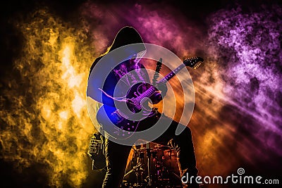 electric guitar player, performing solo on stage, with unique light show Stock Photo