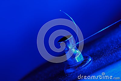 Electric guitar tuning pegs in blue light Stock Photo