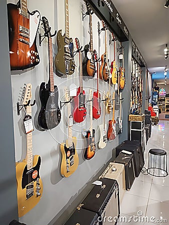 Electric guitars and amplifiers in music store Editorial Stock Photo