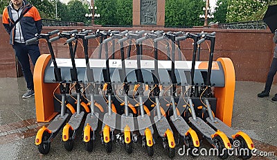 Electric Kick scooter in sharing parking lot. Editorial Stock Photo