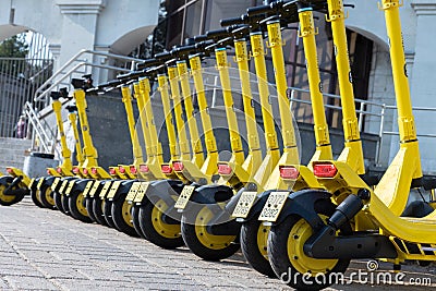 Electric Kick scooter in sharing parking lot, Self-service street transport rental service Stock Photo
