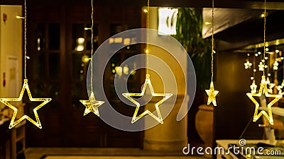 Electric stars with warm yellow lights against a diffused backdrop Stock Photo