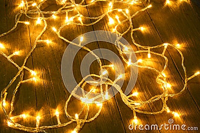 Electric lighted on wooden background Christmas rustic background - vintage planked wood with lights and free text space. Stock Photo