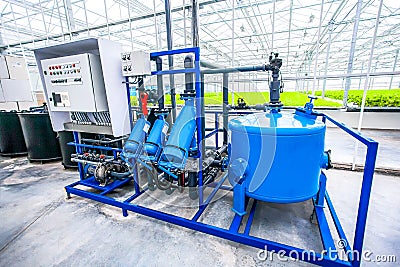 Electric motor water pump at greenhouse Stock Photo