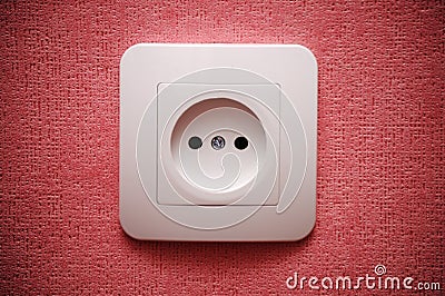 Electric plug connector (outlet) on the wall Stock Photo