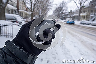 Electric pocket hand warm during snow fall Editorial Stock Photo