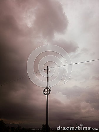 Electric pole on a cloudy day Stock Photo