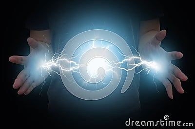 Electric power from hands of magic man Stock Photo