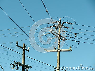 Electric power posts and overhead power lines Stock Photo