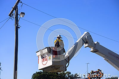 Electric power worker preparing to change street light Editorial Stock Photo