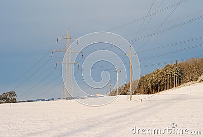 Electric Powerlines Crossing in a Winter Landscape Stock Photo