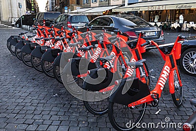 Electric rent bicycle in Piazza del Popolo Rome Italy Editorial Stock Photo
