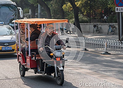 Electric rickshaw or pedicab in Beijing Editorial Stock Photo